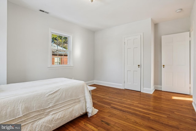 bedroom featuring wood-type flooring