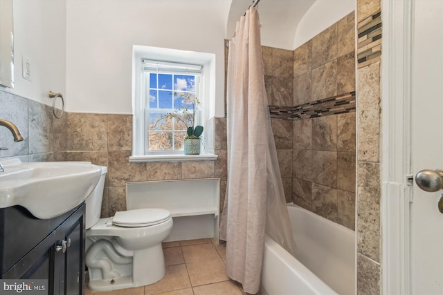 full bathroom with tile walls, tile patterned flooring, vanity, toilet, and shower / bathtub combination with curtain
