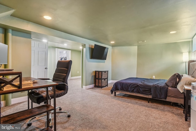 bedroom featuring light carpet