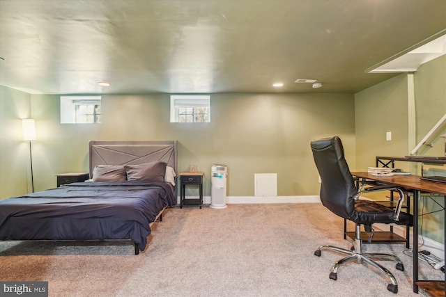 bedroom with multiple windows and carpet flooring