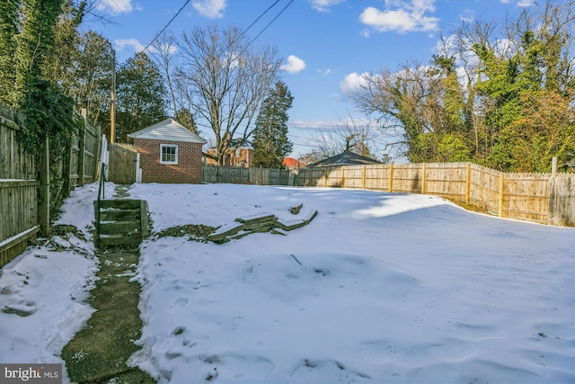 view of yard covered in snow