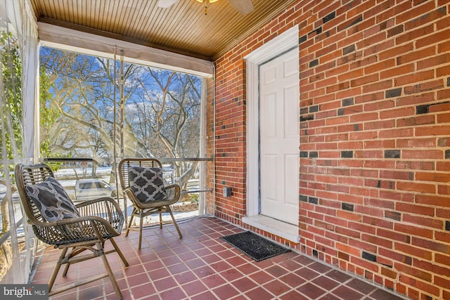 entrance to property with ceiling fan