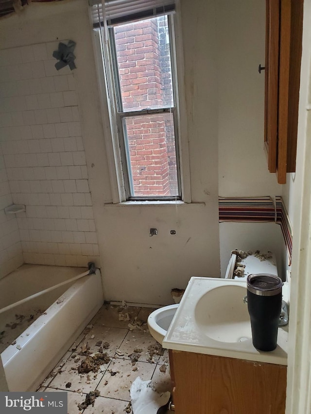 bathroom featuring toilet and vanity