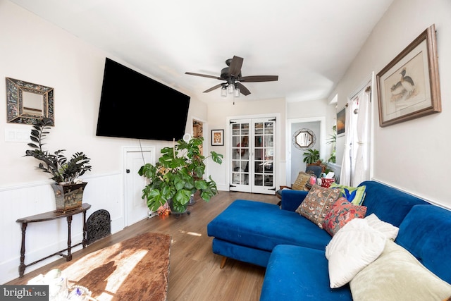 living room with ceiling fan, french doors, and hardwood / wood-style flooring