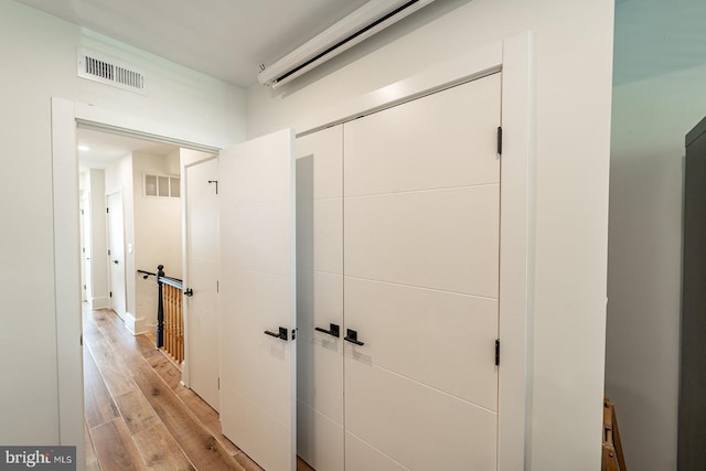 corridor featuring light hardwood / wood-style flooring