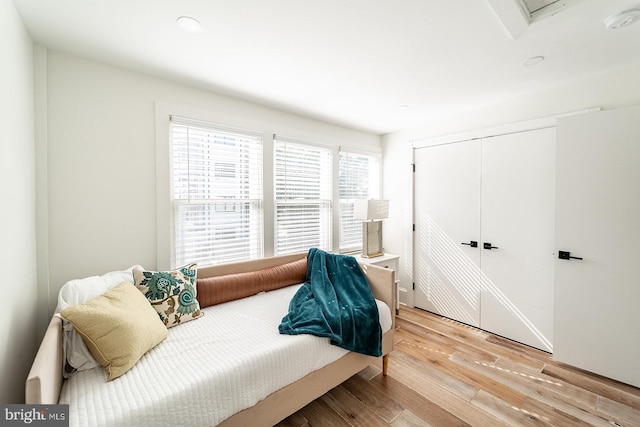 bedroom with a closet and light wood-type flooring