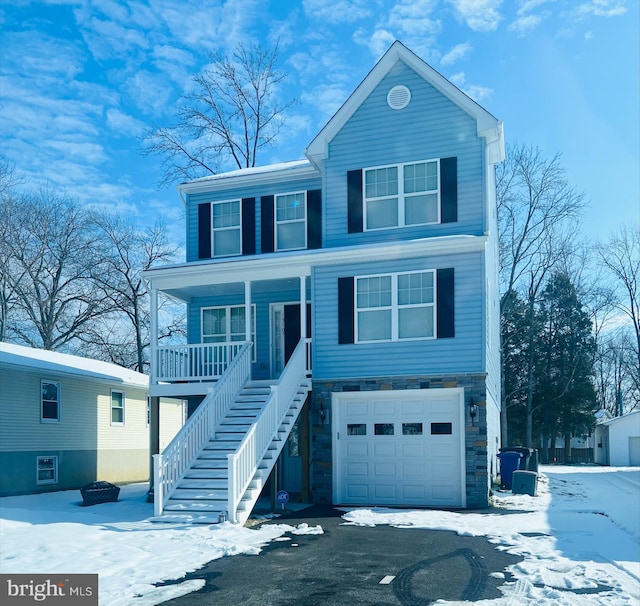 view of front of property with a garage and covered porch