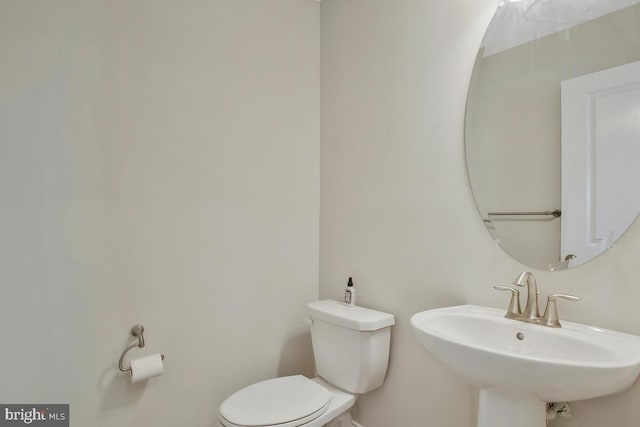 bathroom with sink and toilet