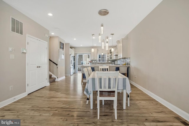 dining room with light wood-type flooring