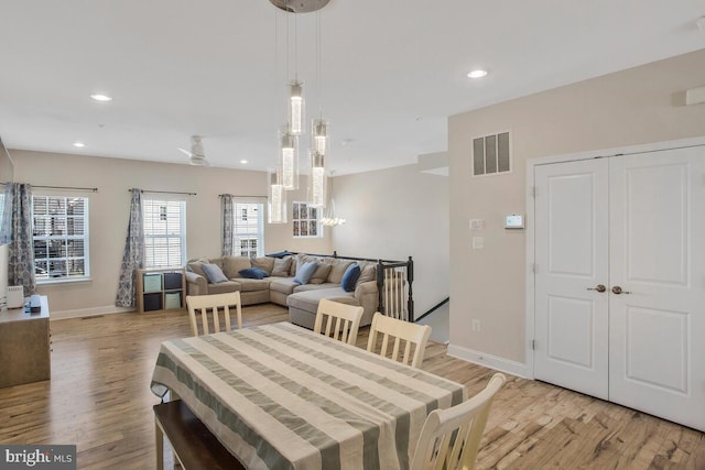 dining space featuring light hardwood / wood-style floors