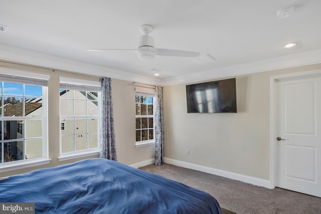 bedroom featuring ornamental molding, carpet, and ceiling fan