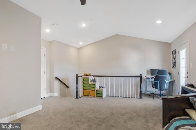 interior space with lofted ceiling and carpet flooring