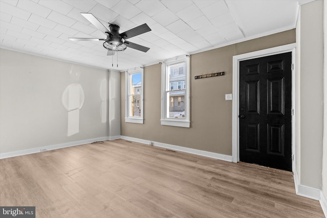 entrance foyer with ceiling fan and light wood-type flooring