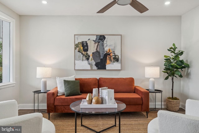 living room with ceiling fan, a wealth of natural light, and hardwood / wood-style floors