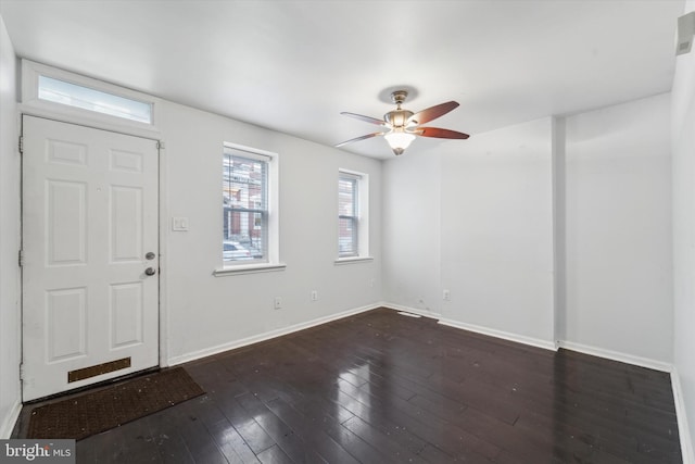 entryway featuring ceiling fan and dark wood-type flooring