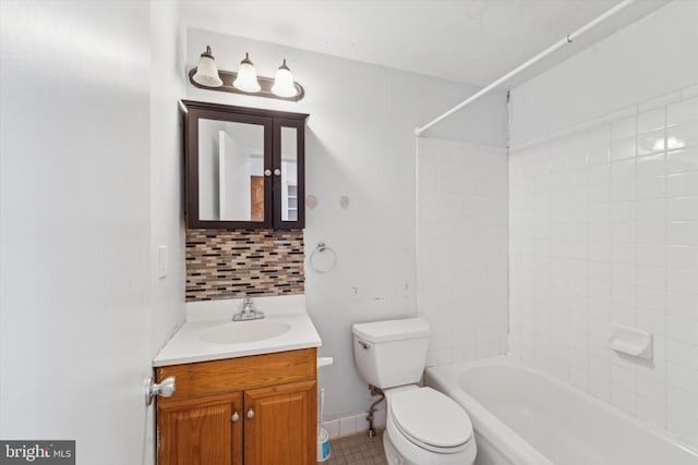 full bathroom featuring decorative backsplash, bathtub / shower combination, toilet, and vanity