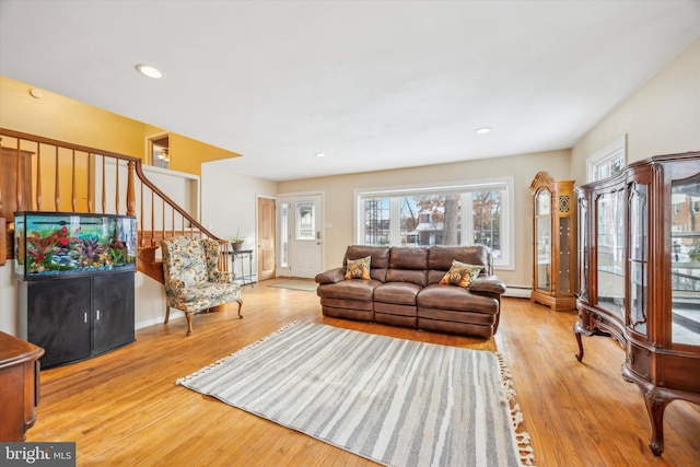 living room with hardwood / wood-style floors and a baseboard radiator