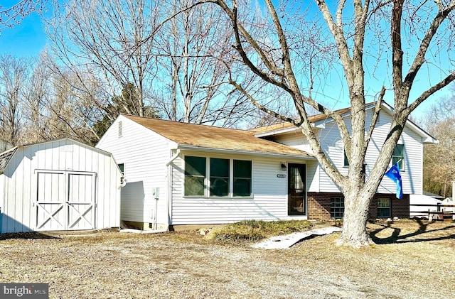 view of front of home featuring a shed