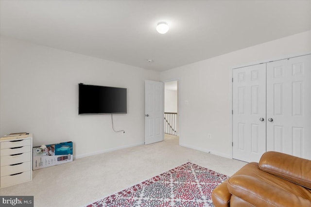 living area with light colored carpet