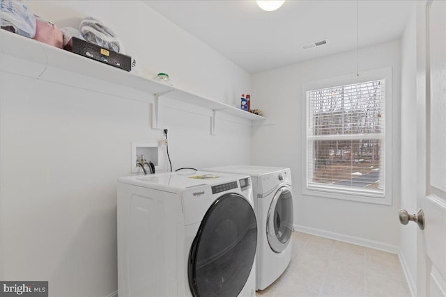 washroom with washing machine and dryer