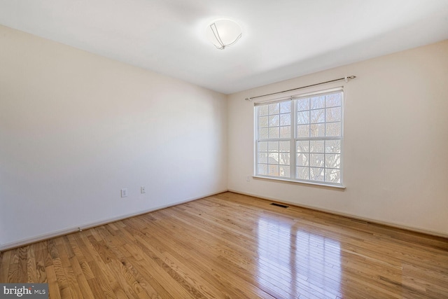 unfurnished room featuring light hardwood / wood-style floors