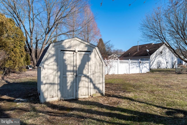 view of outdoor structure featuring a lawn