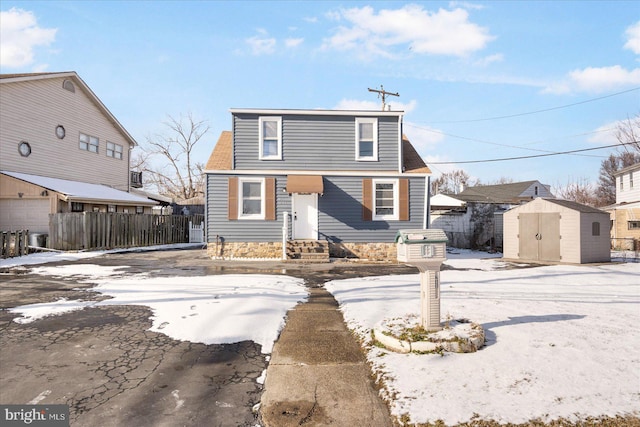 view of front property featuring a storage unit