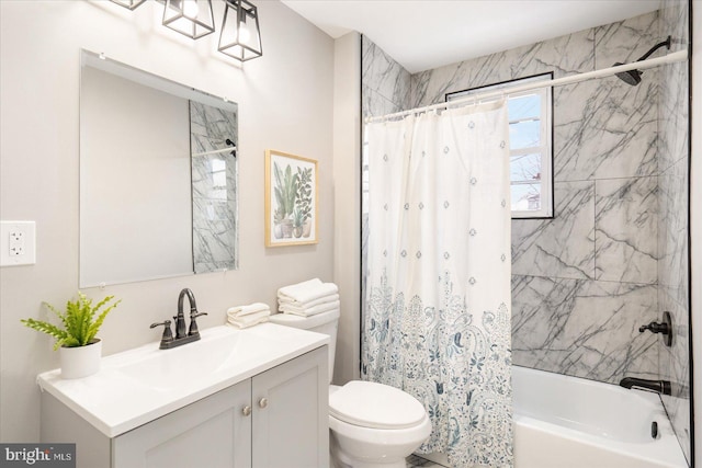 full bathroom with toilet, vanity, and shower / tub combo