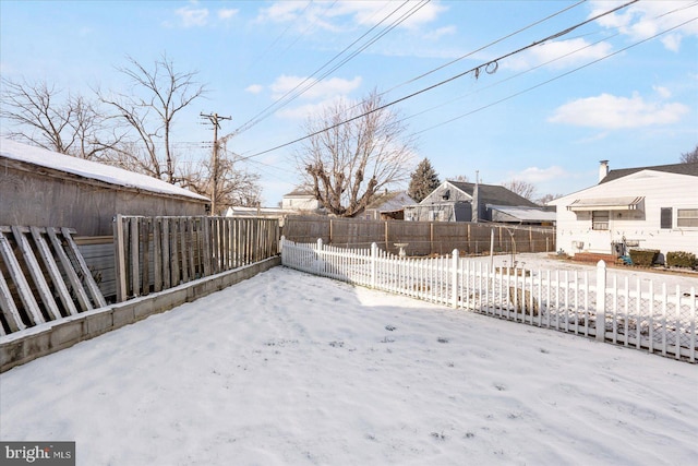 view of yard layered in snow