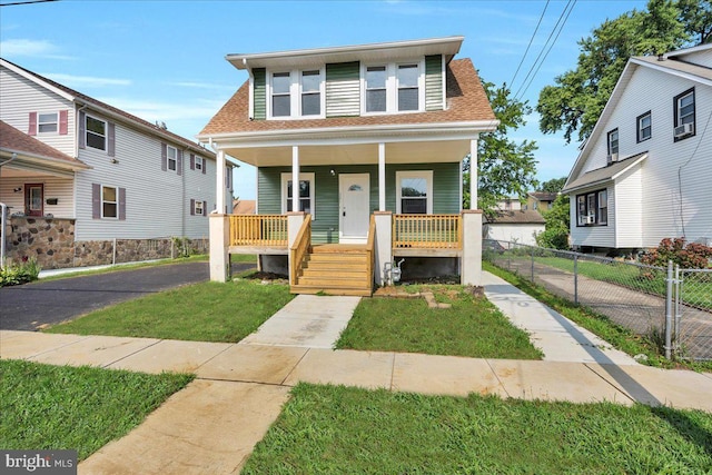 bungalow-style house featuring a front yard and a porch