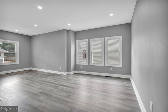 spare room featuring light wood-type flooring