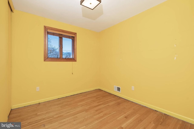 empty room with light hardwood / wood-style floors