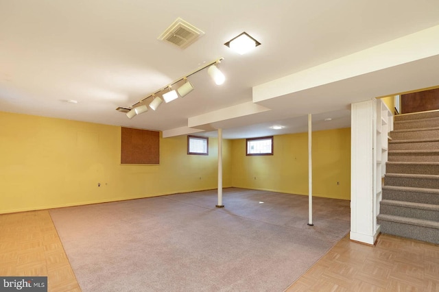 basement featuring parquet floors