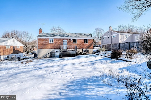 view of snow covered house