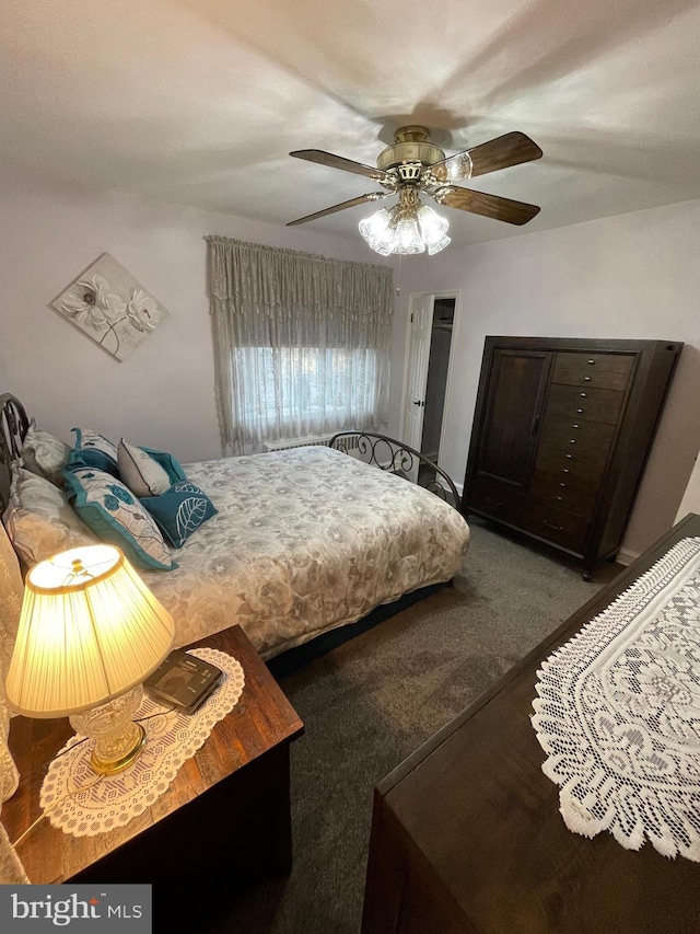 bedroom with dark carpet and ceiling fan