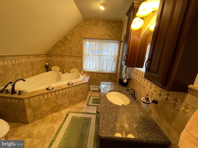 bathroom with lofted ceiling, a baseboard heating unit, vanity, tiled bath, and toilet