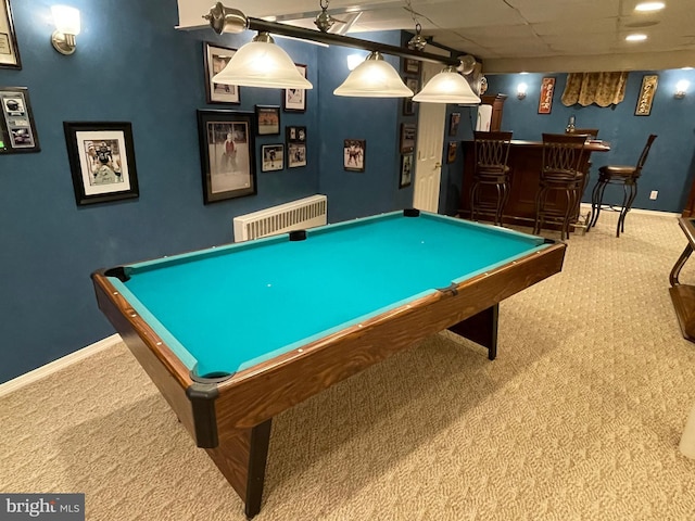 game room with a paneled ceiling, bar, pool table, and carpet floors