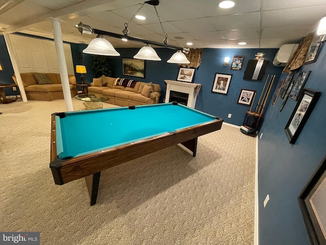 rec room with a paneled ceiling, a wall mounted air conditioner, pool table, and carpet floors