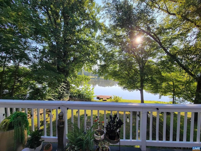 wooden terrace with a water view