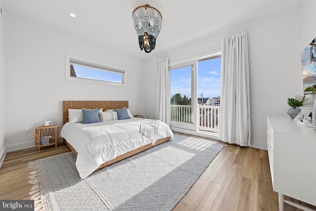 bedroom with hardwood / wood-style floors