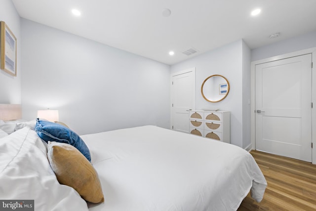 bedroom featuring dark wood-type flooring