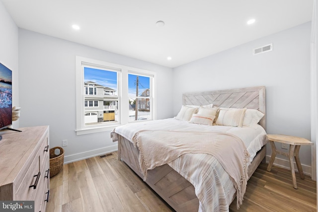 bedroom with light wood-type flooring