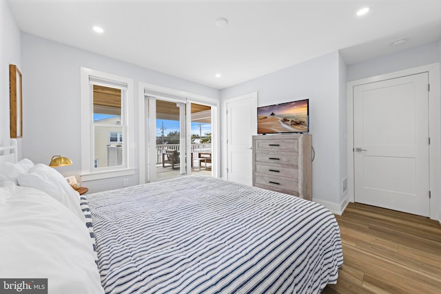 bedroom featuring access to outside and wood-type flooring