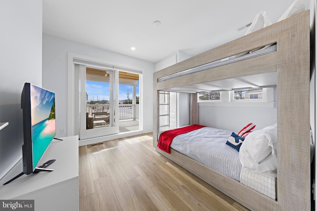 bedroom featuring access to outside and light wood-type flooring