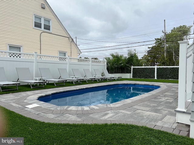 view of swimming pool featuring a patio