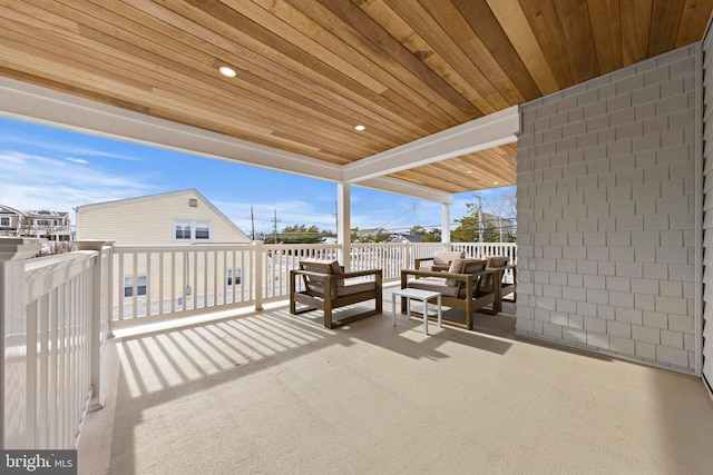 view of patio / terrace with an outdoor living space and a balcony