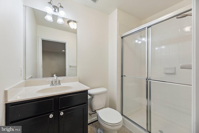 bathroom with vanity, toilet, and walk in shower