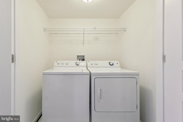 washroom with independent washer and dryer