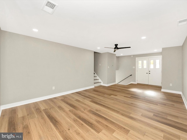 interior space featuring light hardwood / wood-style flooring, ceiling fan, and french doors