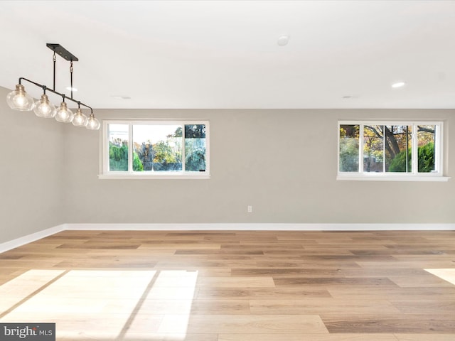 empty room with light hardwood / wood-style floors